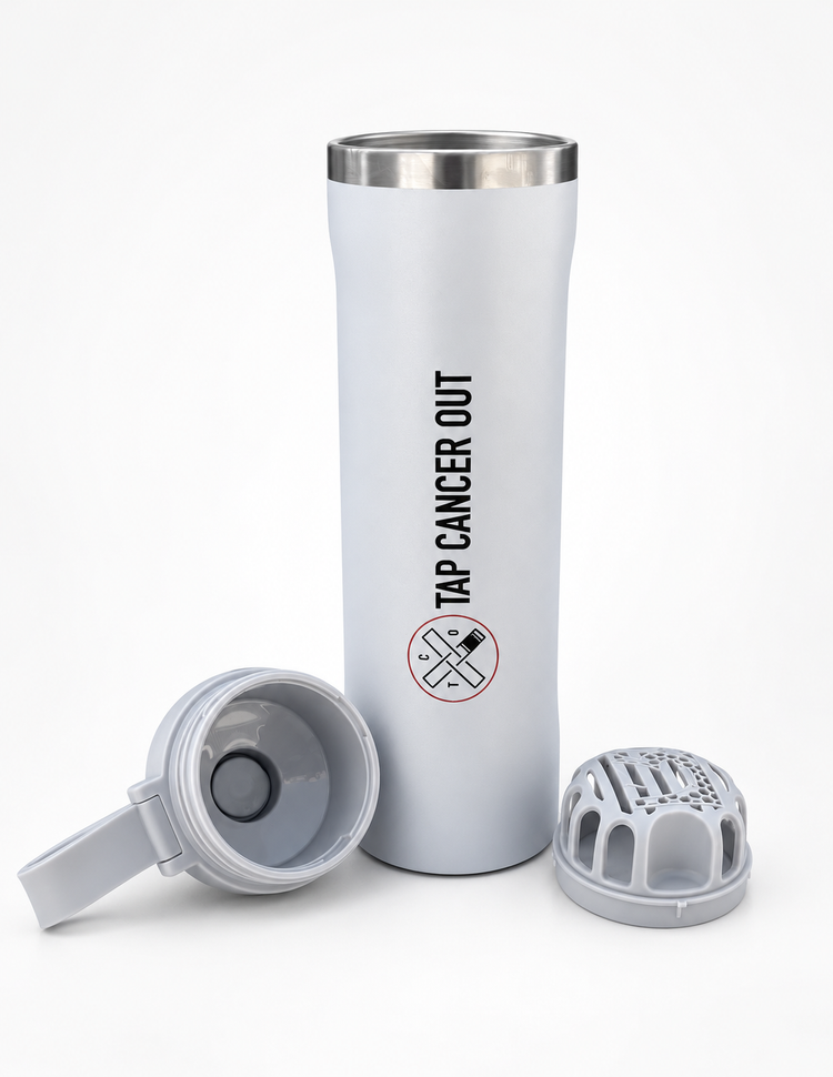 A white insulated travel tumbler with a stainless steel rim, featuring the black printed text 'TAP CANCER OUT' and a crossed-out cancer symbol. The tumbler is shown with its lid and filter cap removed, displayed on a clean white background.